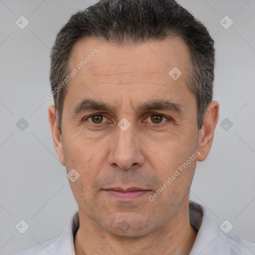 Neutral white adult male with short  black hair and brown eyes