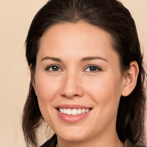 Joyful white young-adult female with medium  brown hair and brown eyes