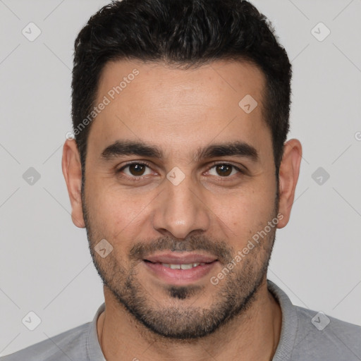 Joyful white young-adult male with short  black hair and brown eyes