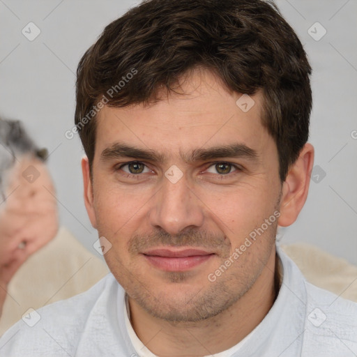 Joyful white young-adult male with short  brown hair and brown eyes