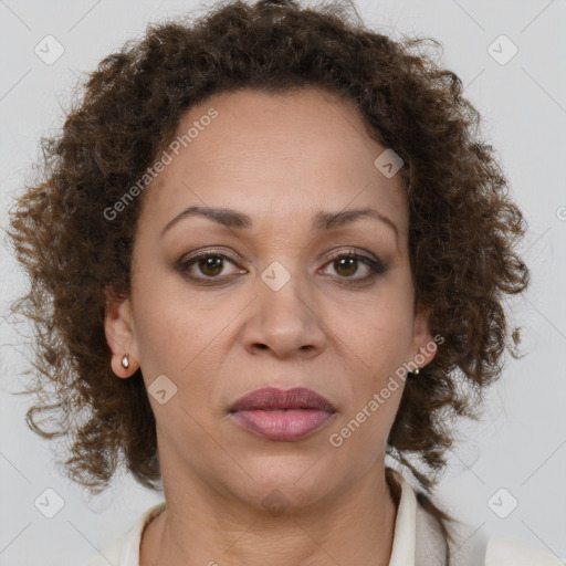 Joyful black adult female with medium  brown hair and brown eyes