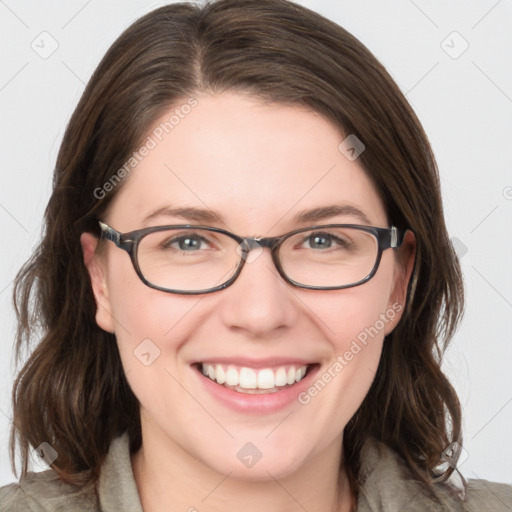 Joyful white young-adult female with medium  brown hair and blue eyes