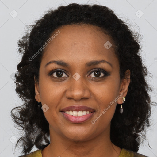 Joyful black young-adult female with long  brown hair and brown eyes