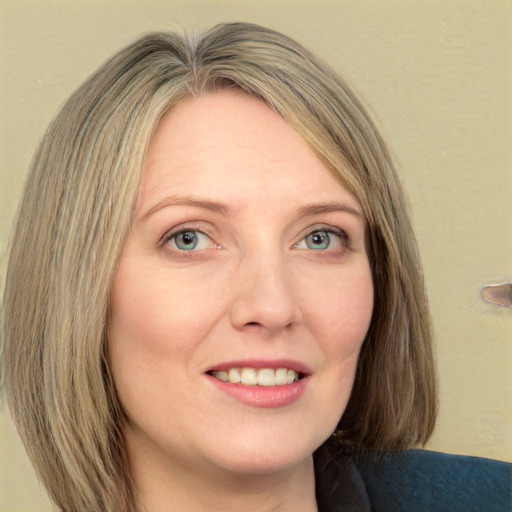 Joyful white adult female with long  brown hair and green eyes