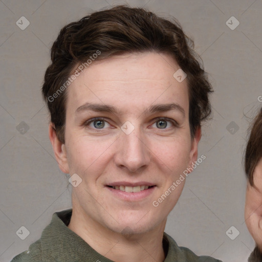 Joyful white young-adult female with short  brown hair and grey eyes