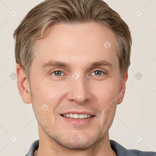 Joyful white adult male with short  brown hair and grey eyes