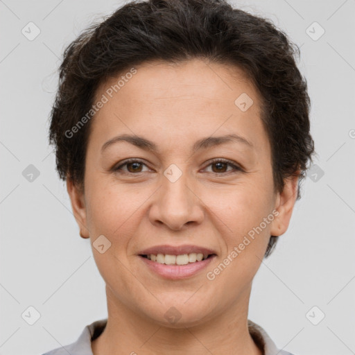 Joyful white adult female with short  brown hair and brown eyes