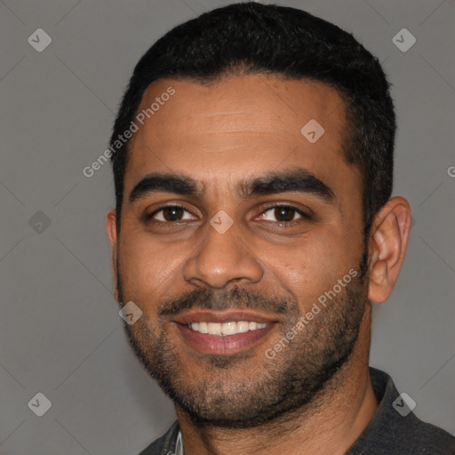 Joyful black young-adult male with short  black hair and brown eyes