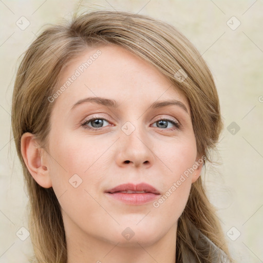 Joyful white young-adult female with long  brown hair and blue eyes