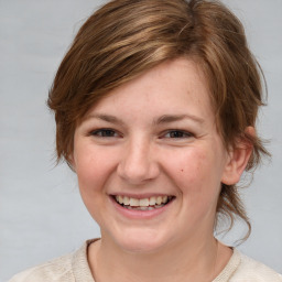 Joyful white young-adult female with medium  brown hair and blue eyes