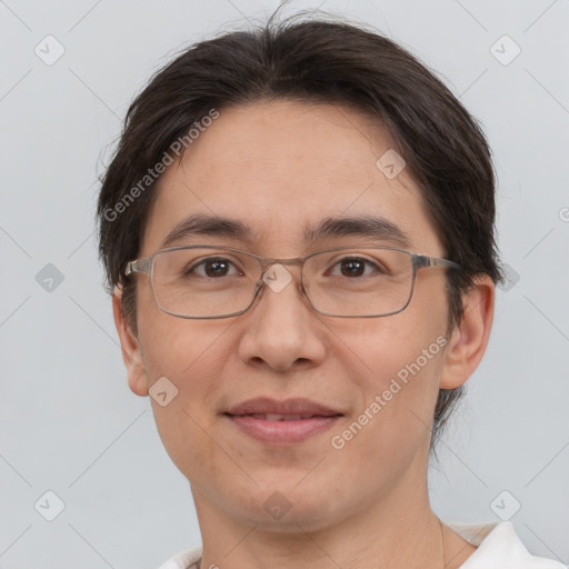 Joyful white adult female with short  brown hair and brown eyes