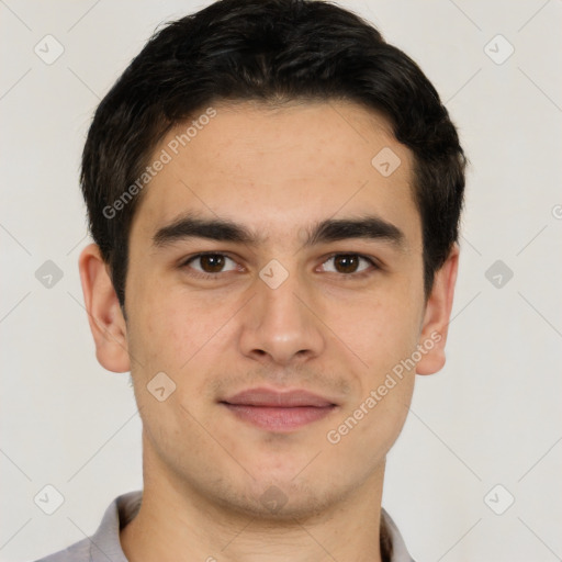 Joyful latino young-adult male with short  brown hair and brown eyes