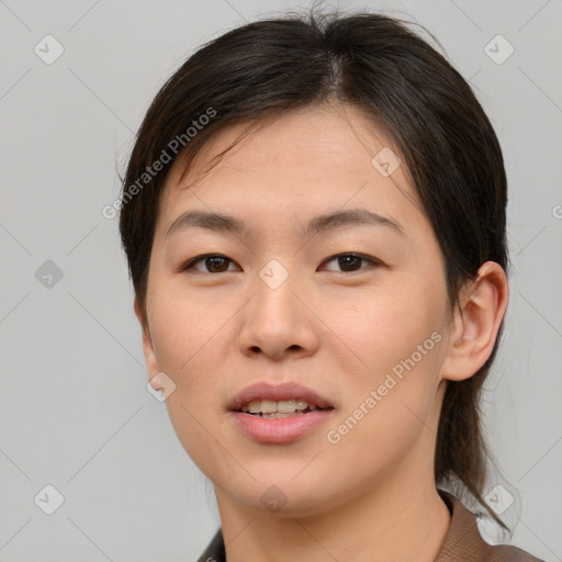 Joyful asian young-adult female with short  brown hair and brown eyes