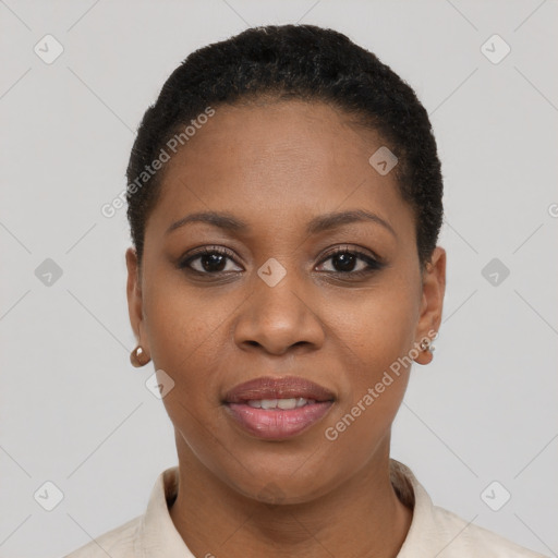 Joyful black young-adult female with short  black hair and brown eyes