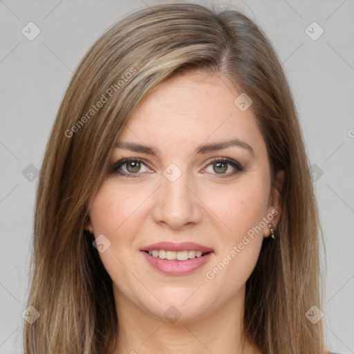 Joyful white young-adult female with long  brown hair and green eyes