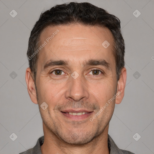 Joyful white adult male with short  brown hair and brown eyes