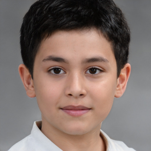 Joyful white child male with short  brown hair and brown eyes