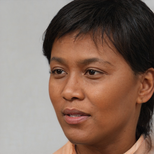 Neutral asian young-adult female with short  brown hair and brown eyes