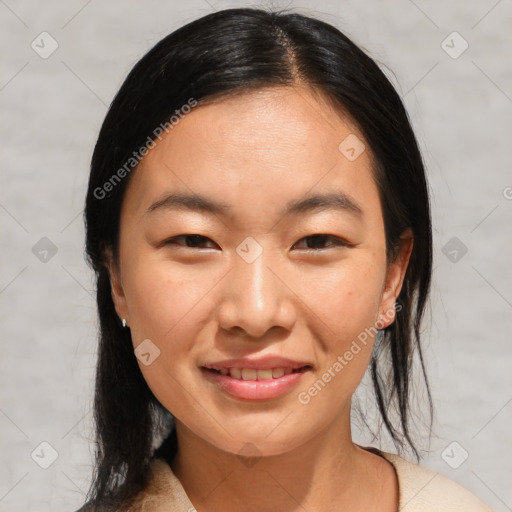 Joyful asian young-adult female with medium  black hair and brown eyes