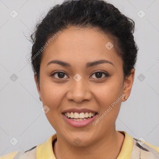 Joyful latino young-adult female with short  brown hair and brown eyes