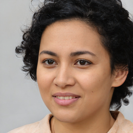 Joyful latino young-adult female with medium  black hair and brown eyes