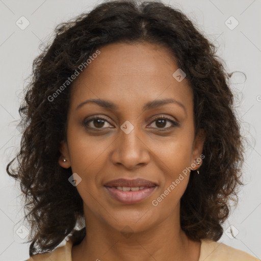 Joyful black adult female with medium  brown hair and brown eyes