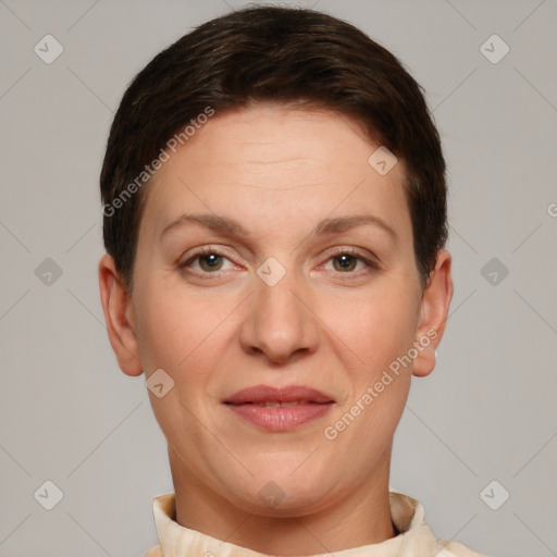 Joyful white adult female with short  brown hair and brown eyes