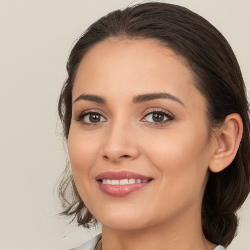 Joyful white young-adult female with medium  brown hair and brown eyes