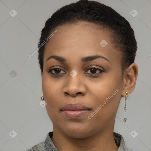 Joyful black young-adult female with short  brown hair and brown eyes