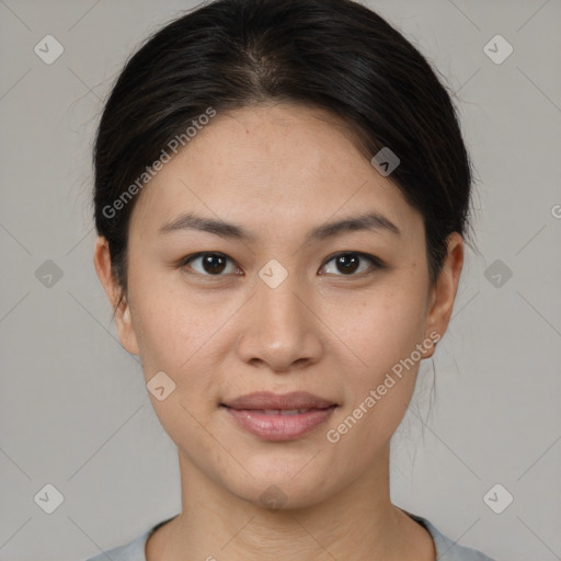 Joyful asian young-adult female with short  brown hair and brown eyes