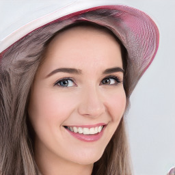 Joyful white young-adult female with long  brown hair and blue eyes