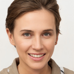 Joyful white young-adult female with short  brown hair and grey eyes