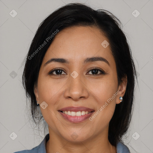 Joyful latino young-adult female with medium  black hair and brown eyes