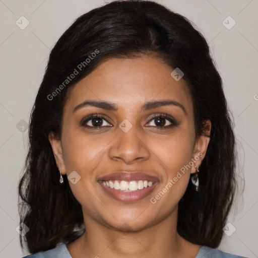Joyful black young-adult female with medium  brown hair and brown eyes