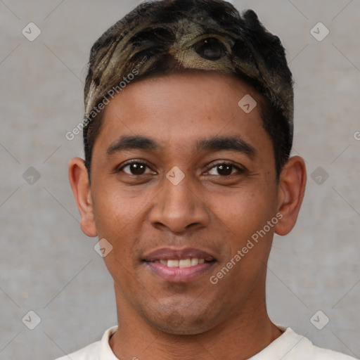 Joyful white young-adult male with short  black hair and brown eyes