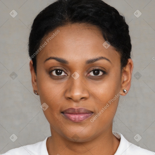 Joyful black young-adult female with short  black hair and brown eyes