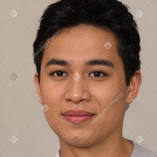 Joyful asian young-adult male with short  brown hair and brown eyes