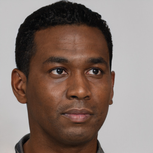 Neutral black young-adult male with short  black hair and brown eyes