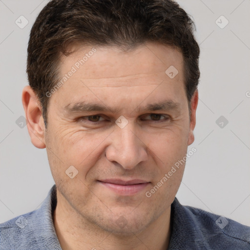 Joyful white adult male with short  brown hair and grey eyes