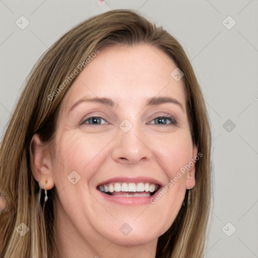 Joyful white adult female with long  brown hair and grey eyes