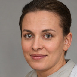 Joyful white adult female with short  brown hair and brown eyes