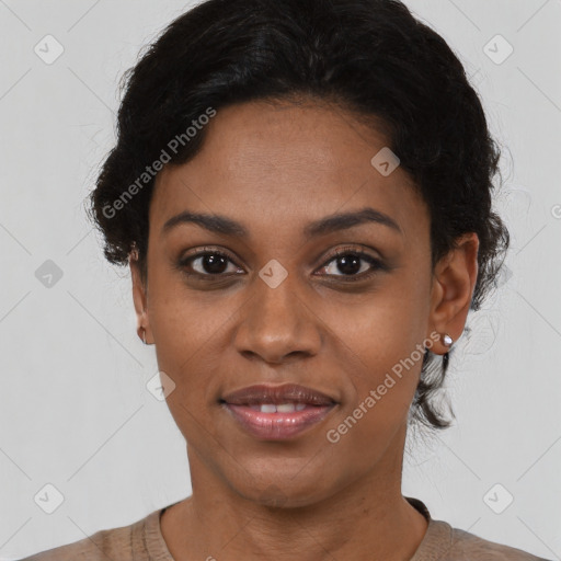 Joyful black young-adult female with short  black hair and brown eyes