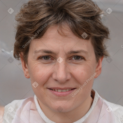 Joyful white adult female with short  brown hair and brown eyes