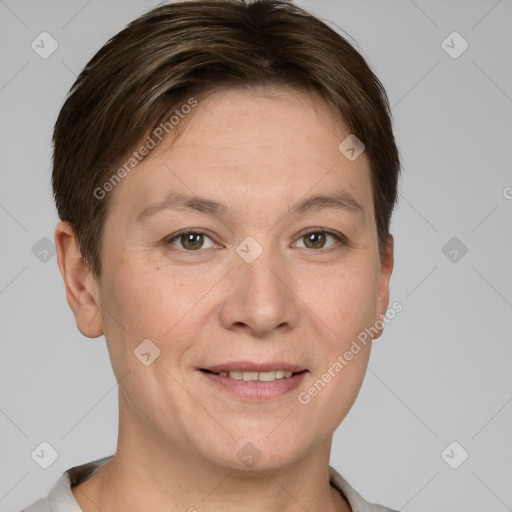 Joyful white adult female with short  brown hair and grey eyes