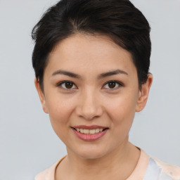 Joyful asian young-adult female with short  brown hair and brown eyes