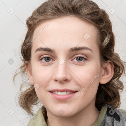 Joyful white young-adult female with medium  brown hair and blue eyes