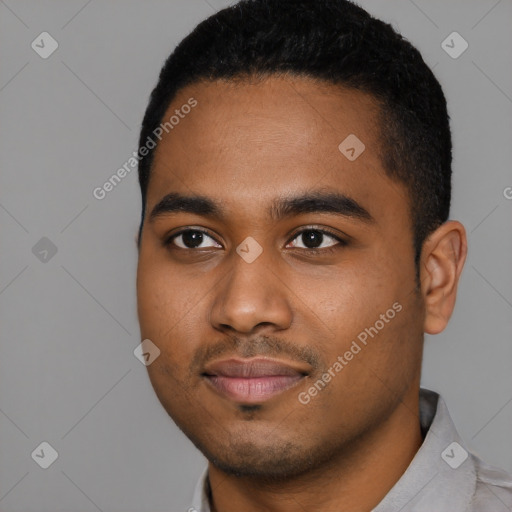 Joyful black young-adult male with short  black hair and brown eyes
