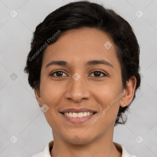 Joyful latino young-adult female with short  brown hair and brown eyes