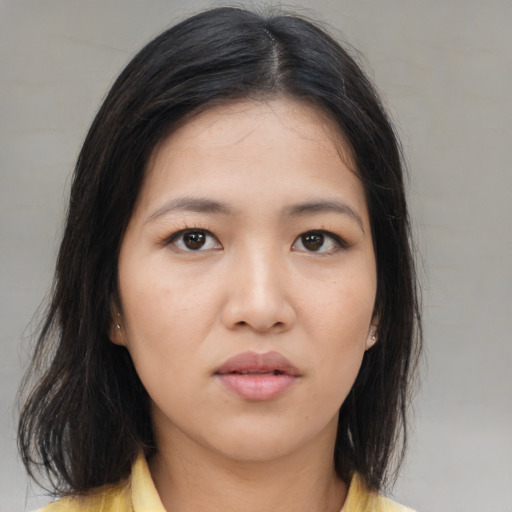 Neutral asian young-adult female with medium  brown hair and brown eyes