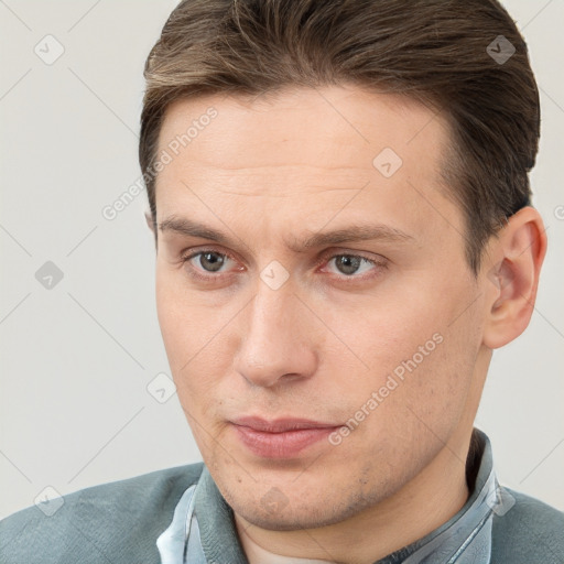 Neutral white young-adult male with short  brown hair and brown eyes